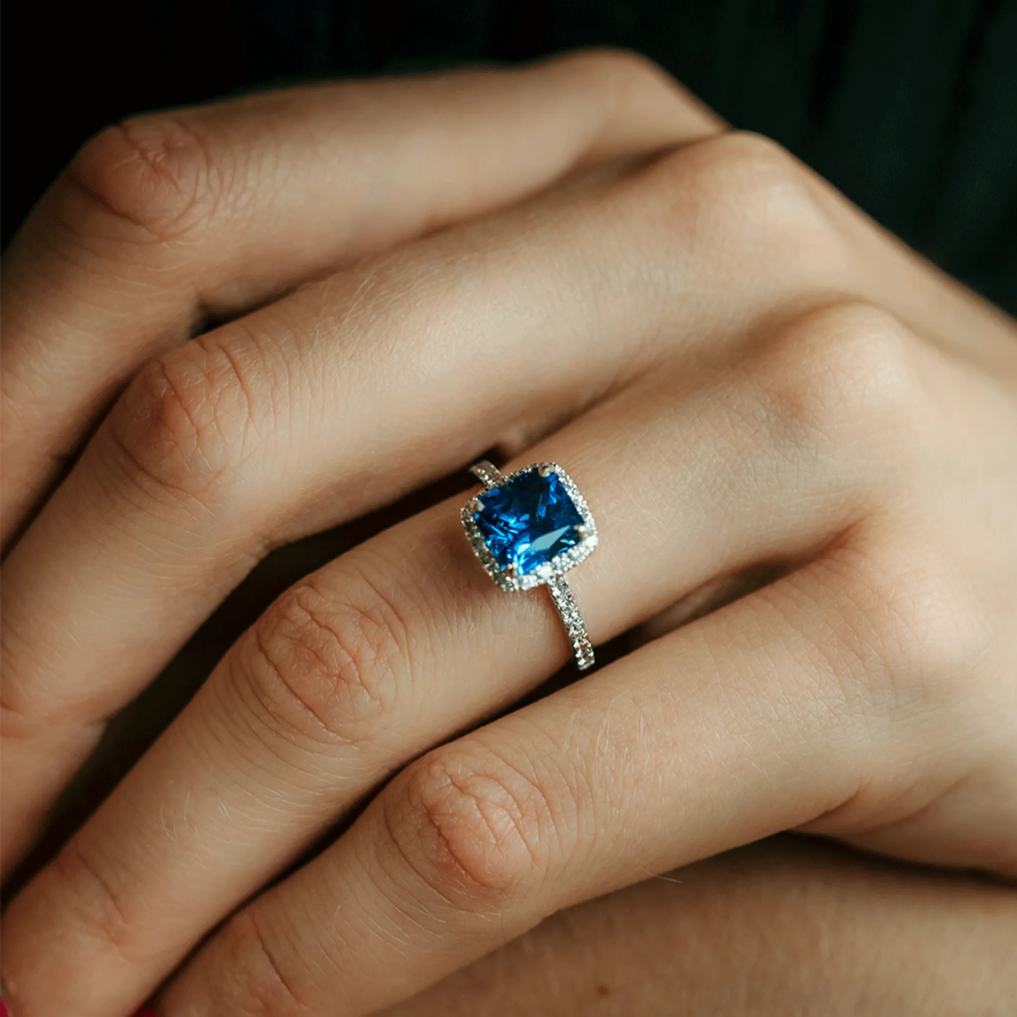 Blue Sapphire and Diamond Halo Engagement Ring