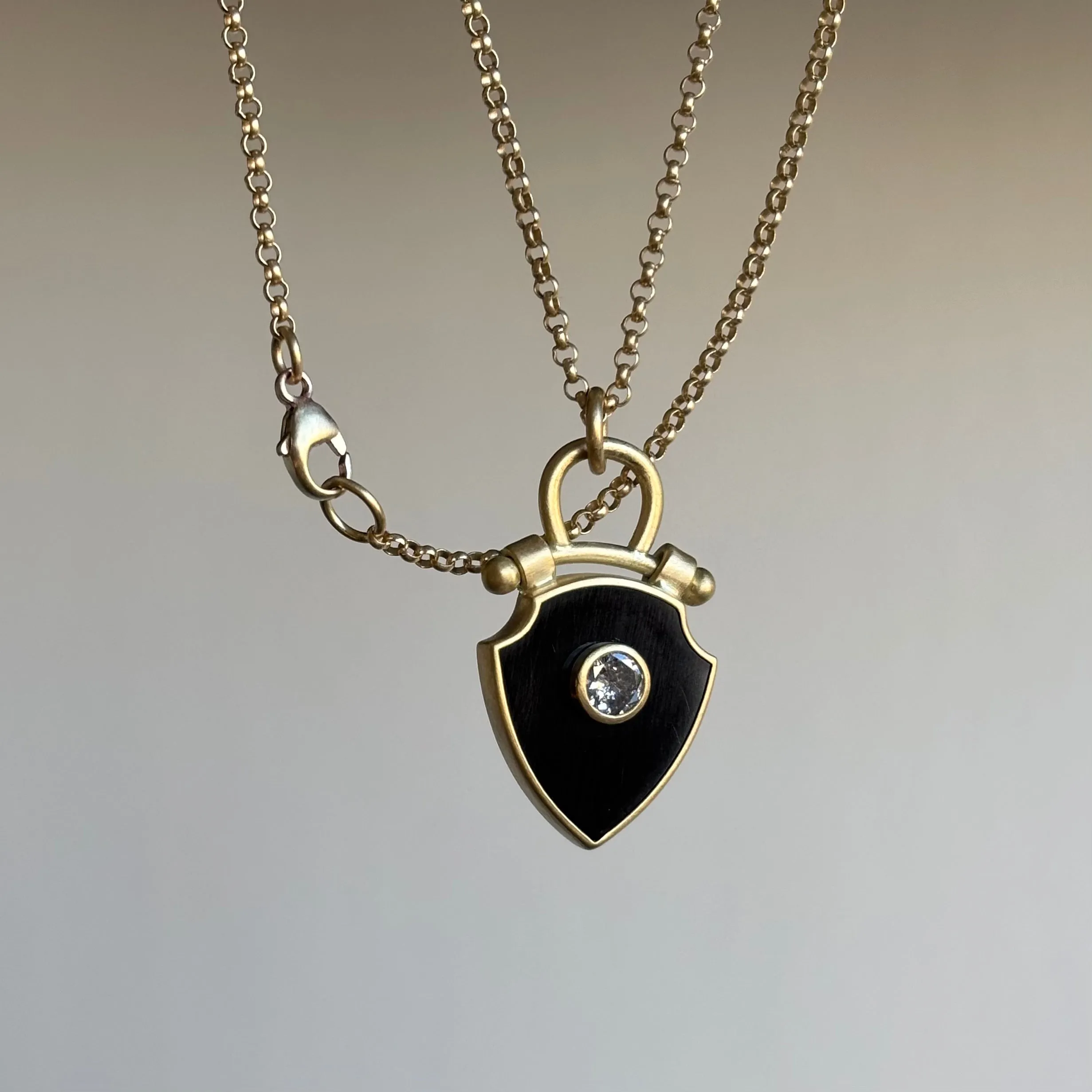 Curved Top Onyx Shield Pendant with Diamond